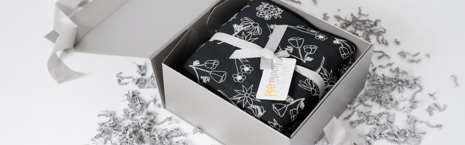 Gift wrap and handwritten cards to make your blanket the perfect gift.
