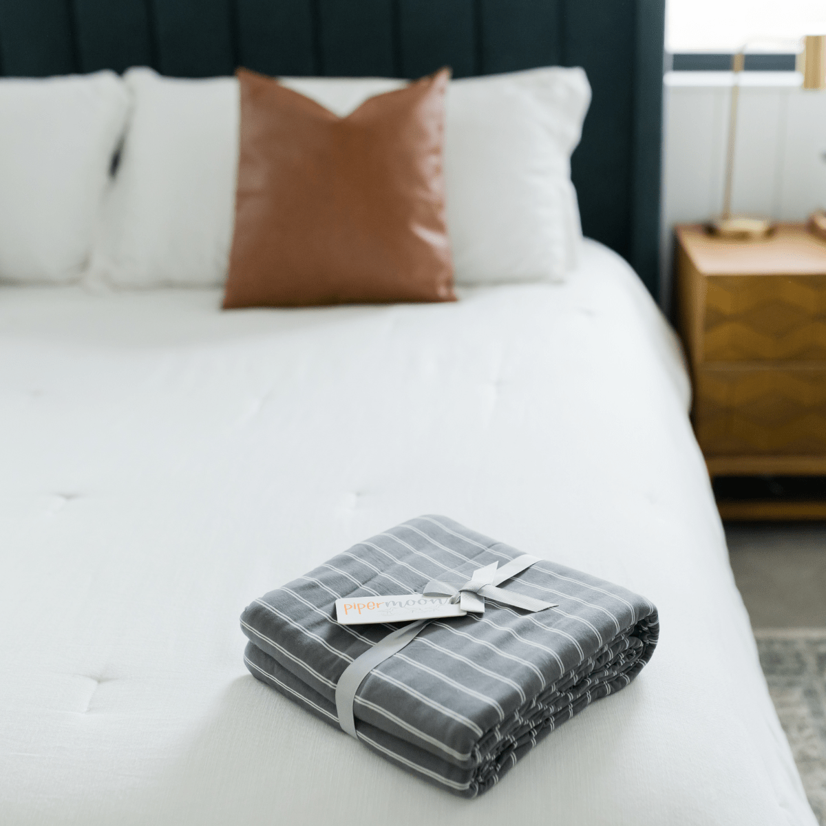 Tundra bed blanket comes in King/California king in a neutral charcoal gray and tiny white stripe design.