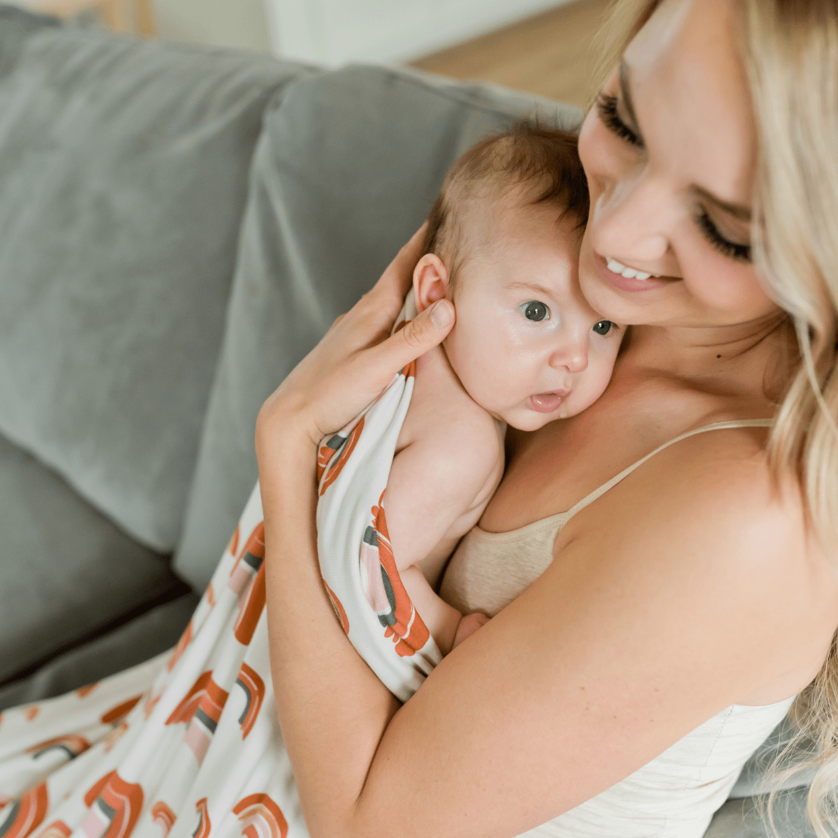 Modern baby swaddle blanket is the perfect baby shower or newborn gift, especially if baby is a Rainbow baby.
