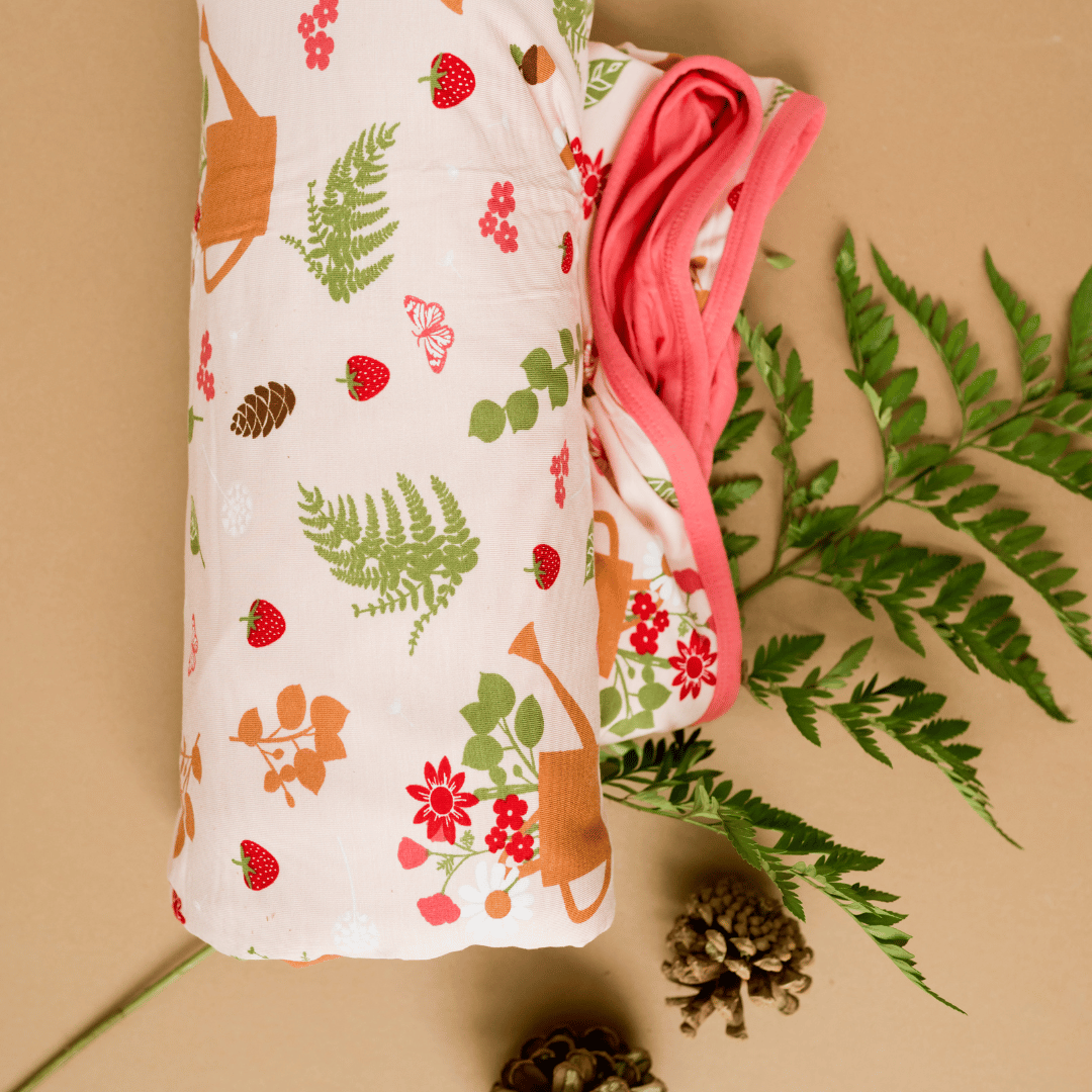 Cozy cottage hug blanket for strawberry and floral lovers.