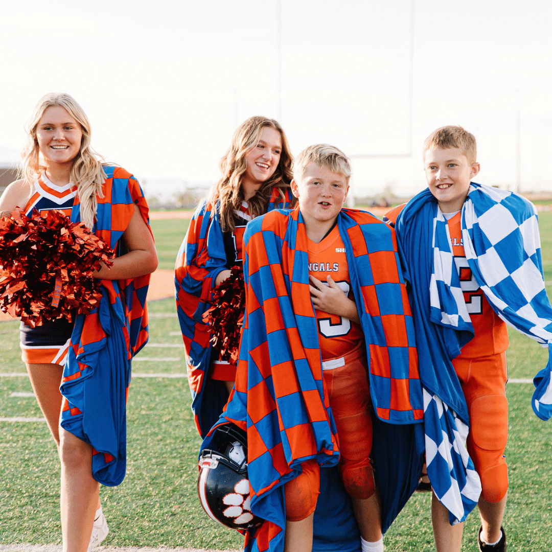 Shareable and packable blue and white checkered blanket for players and watchers.