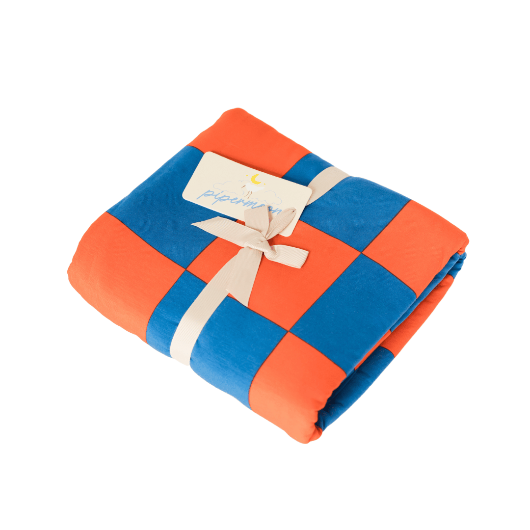 Calling all Denver Bronco and New York Knicks fans for the perfect wrappable orange and blue checked blanket.