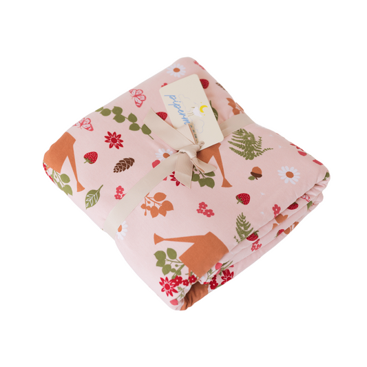 Perfect cottage core adult swaddle blanket with strawberries, acorns, ferns, and watering can print.
