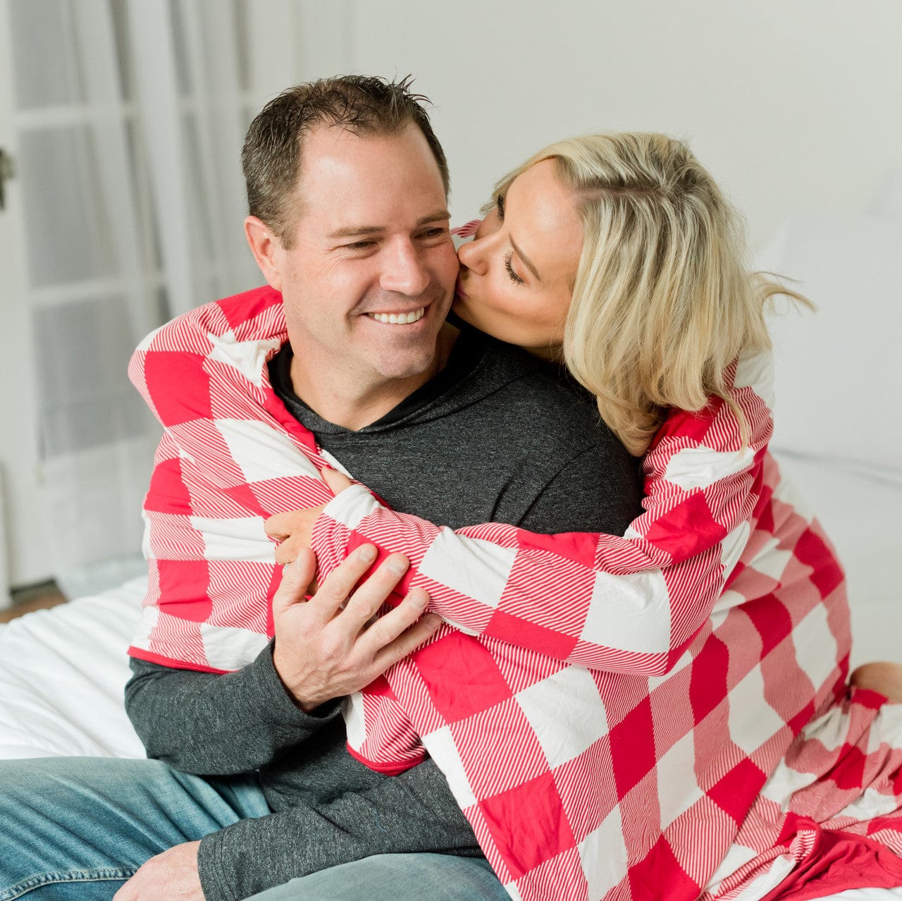 Hug throw blanket in red and white buffalo plaid for cozy days on the couch.
