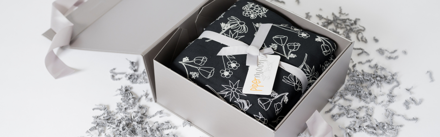 Gift wrap and handwritten cards to make your blanket the perfect gift. 