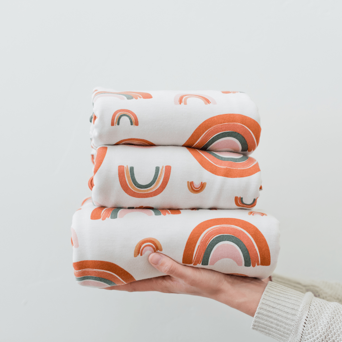 Our swaddle blankets come in various sizes from baby to jumbo.  Modern rainbow is a symbol of hope. 