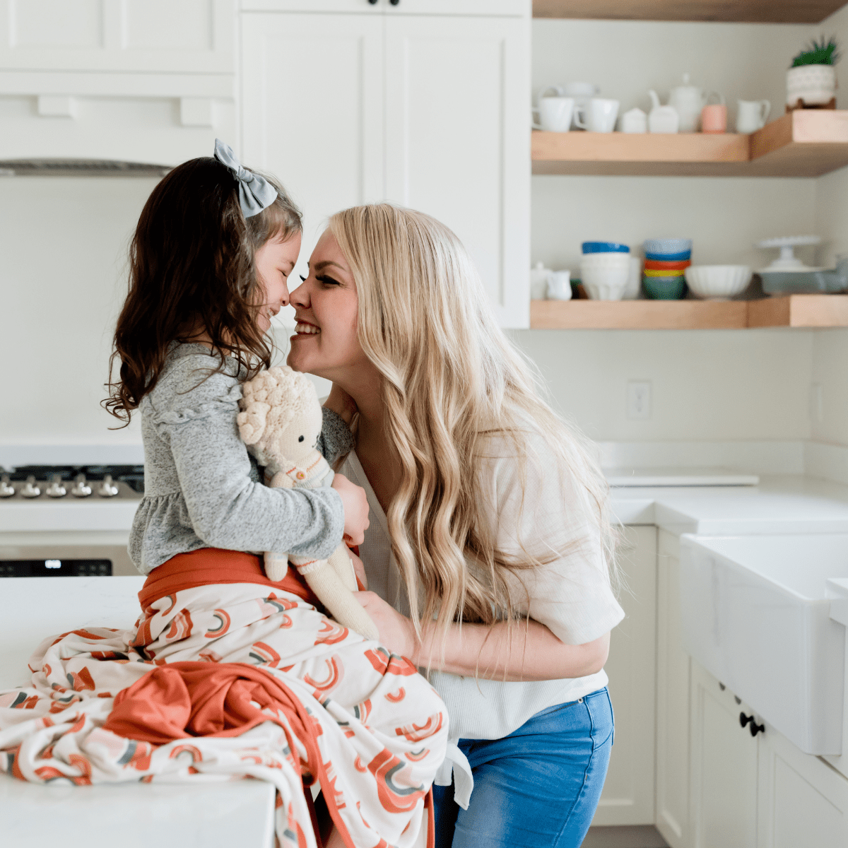 Child size modern rainbow blanket for all the mommy and me hugs. 