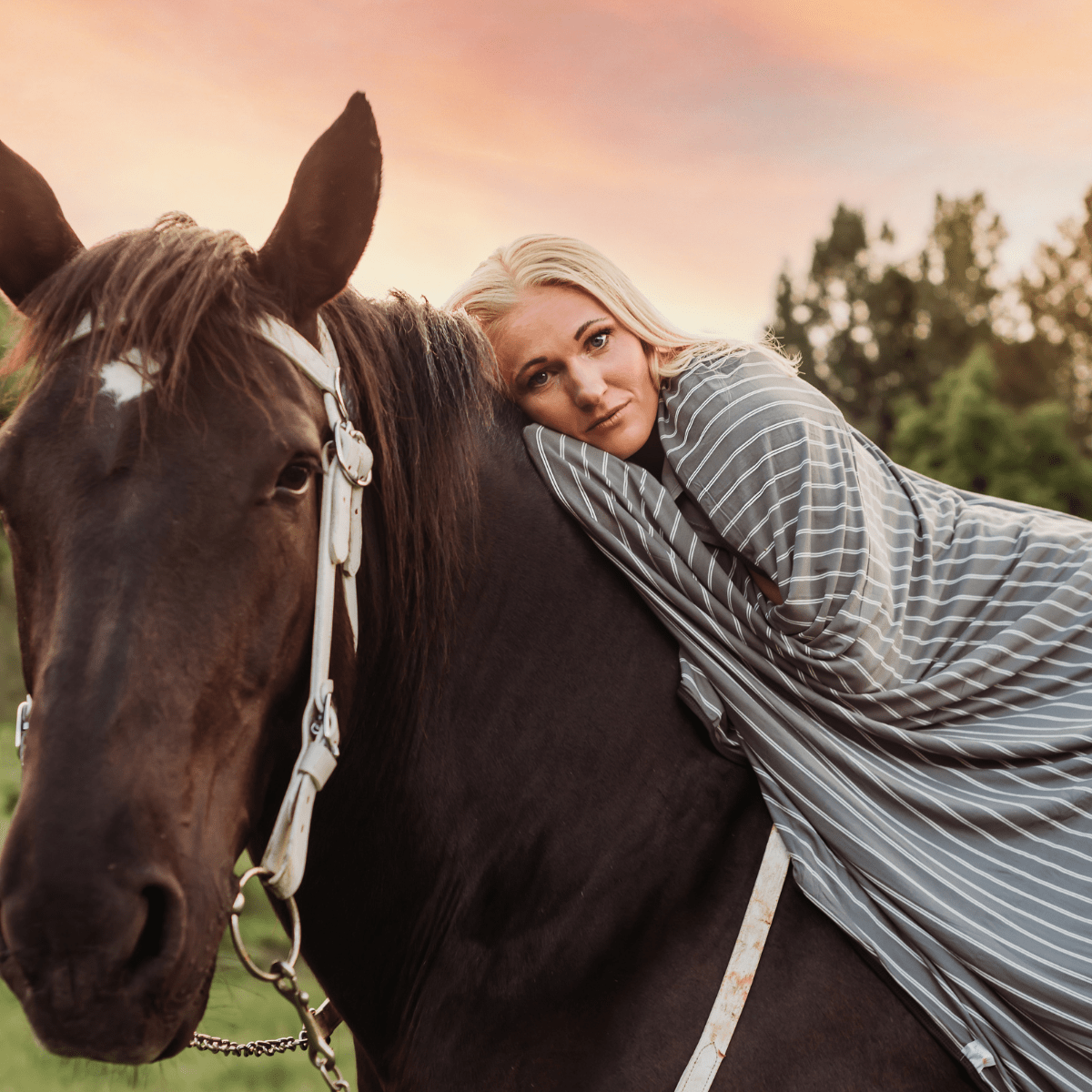 Jersey knit modal adult swaddle blanket in gray and white stripes with a charcoal gray backing. 