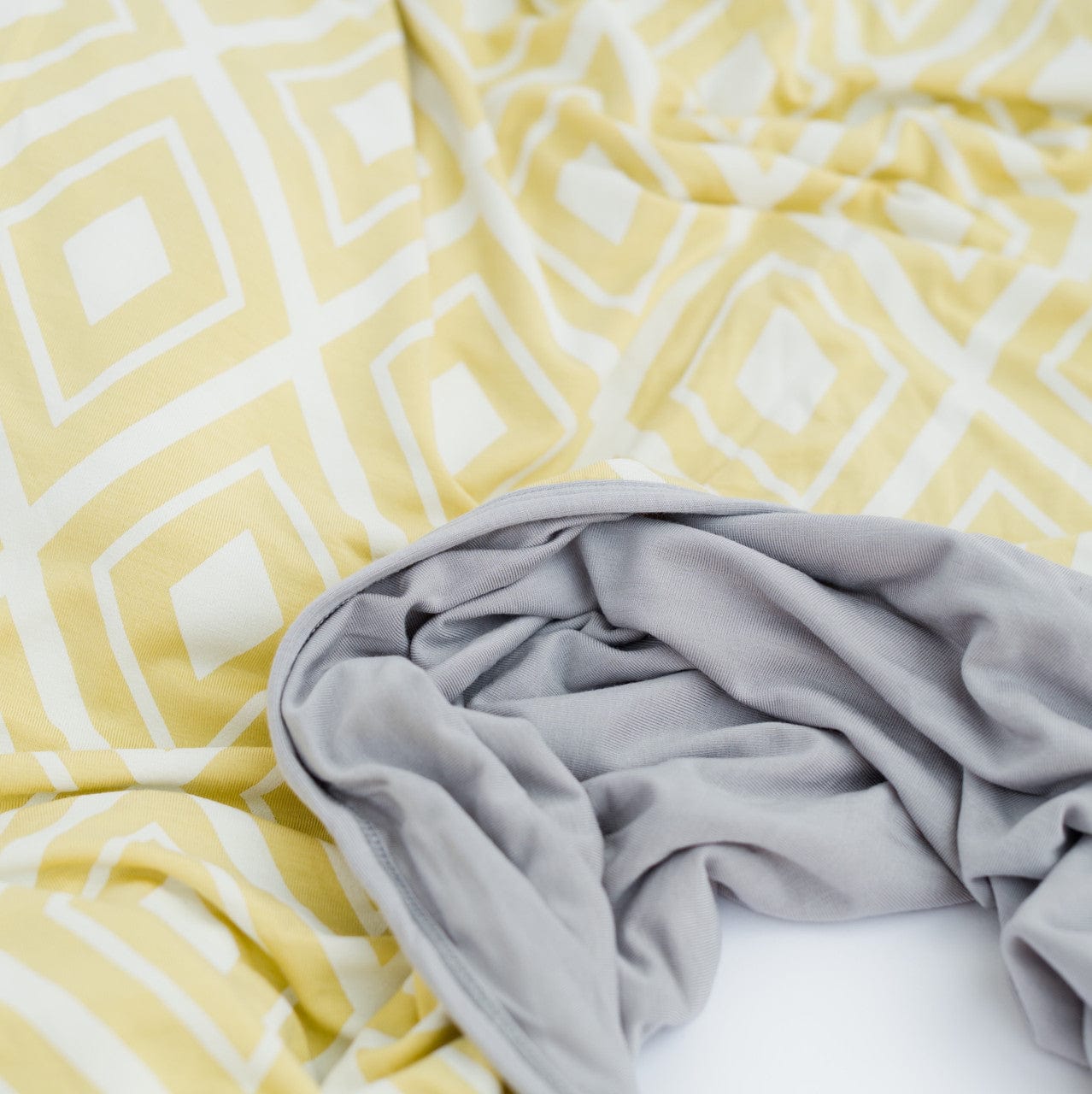 Yellow picnic background blanket, yellow diamond, grey wearable blanket.