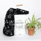 Neutral garden blanket with flowers black and white monochromatic.