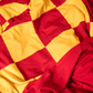 Double sized Harry Potter Gryffindor House colored blanket in red and gold checks. 