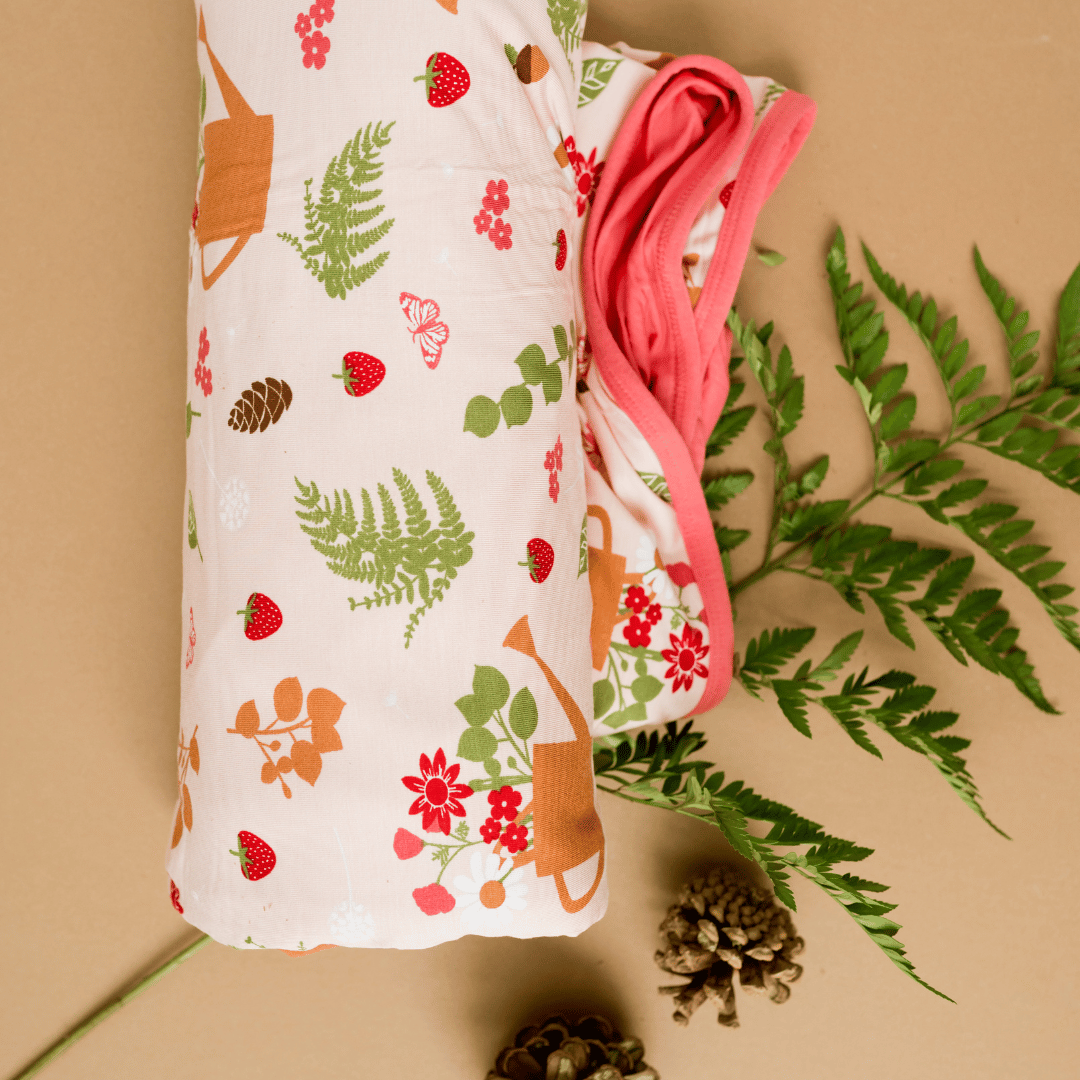 Cozy cottage blanket for strawberry and floral lovers.