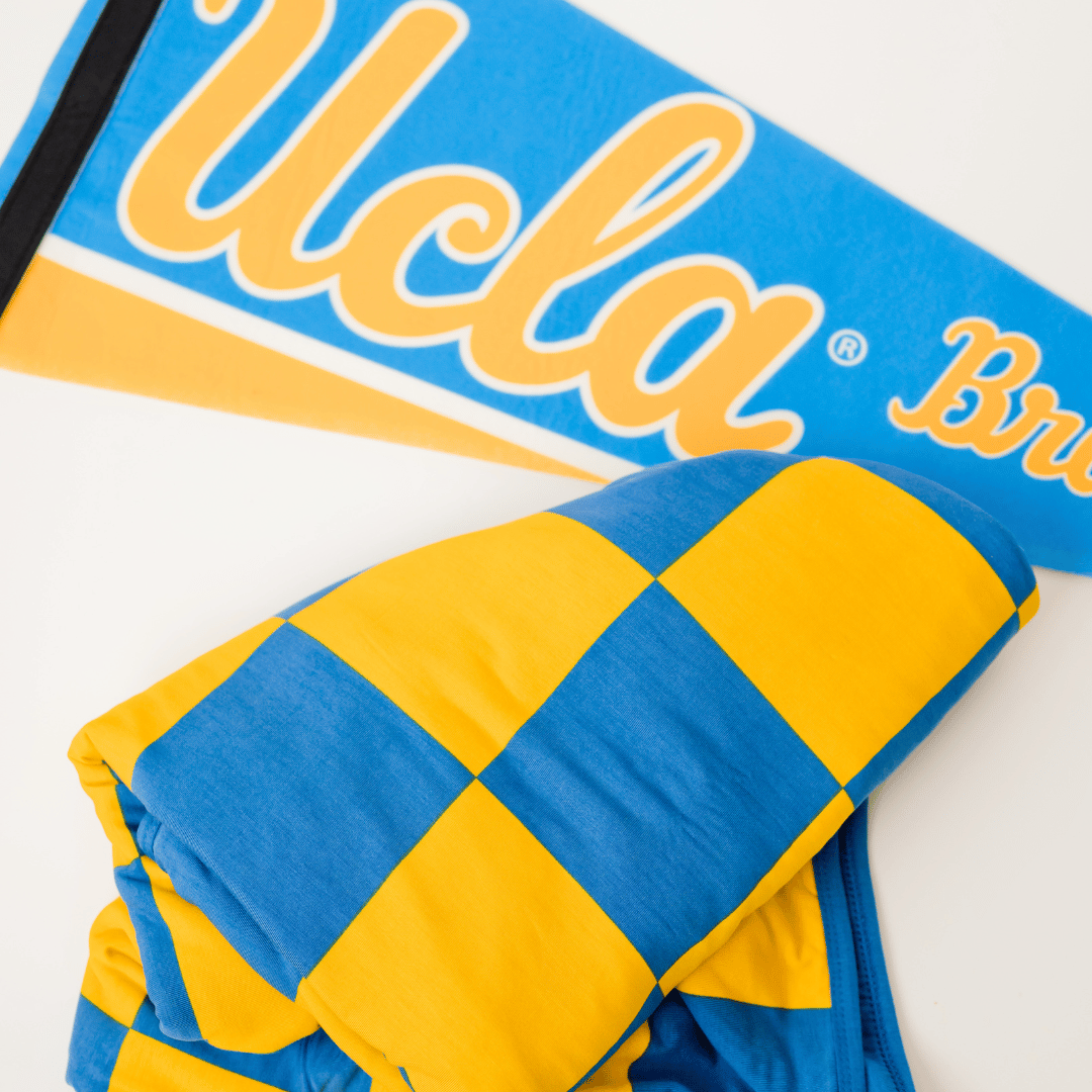 Packable blanket for tailgating and watching games.