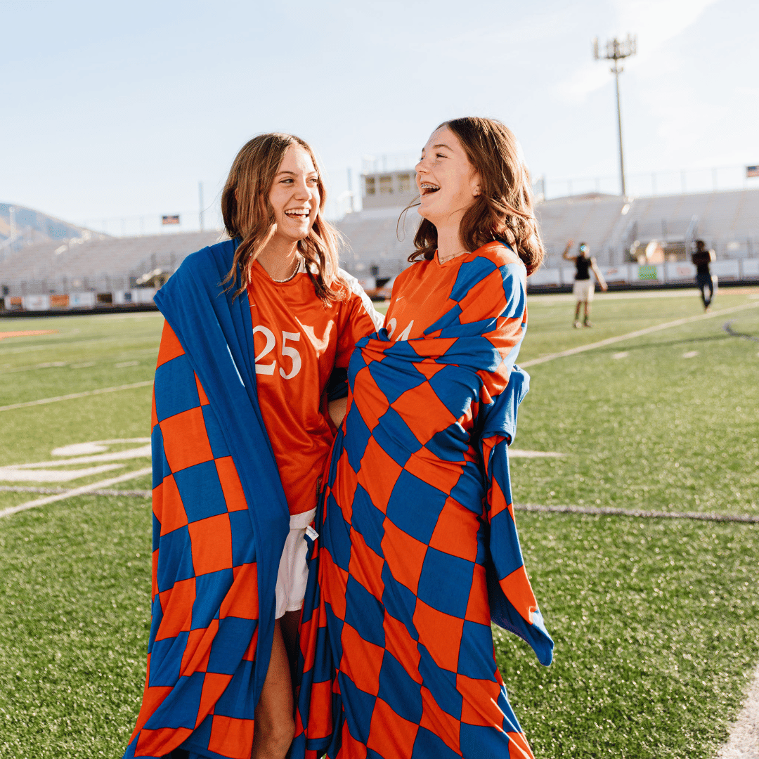High school color soccer game blanket. Orange and blue checkered. 