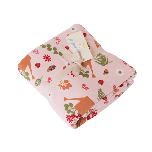 Perfect cottage core adult swaddle blanket with strawberries, acorns, ferns, and watering can prints