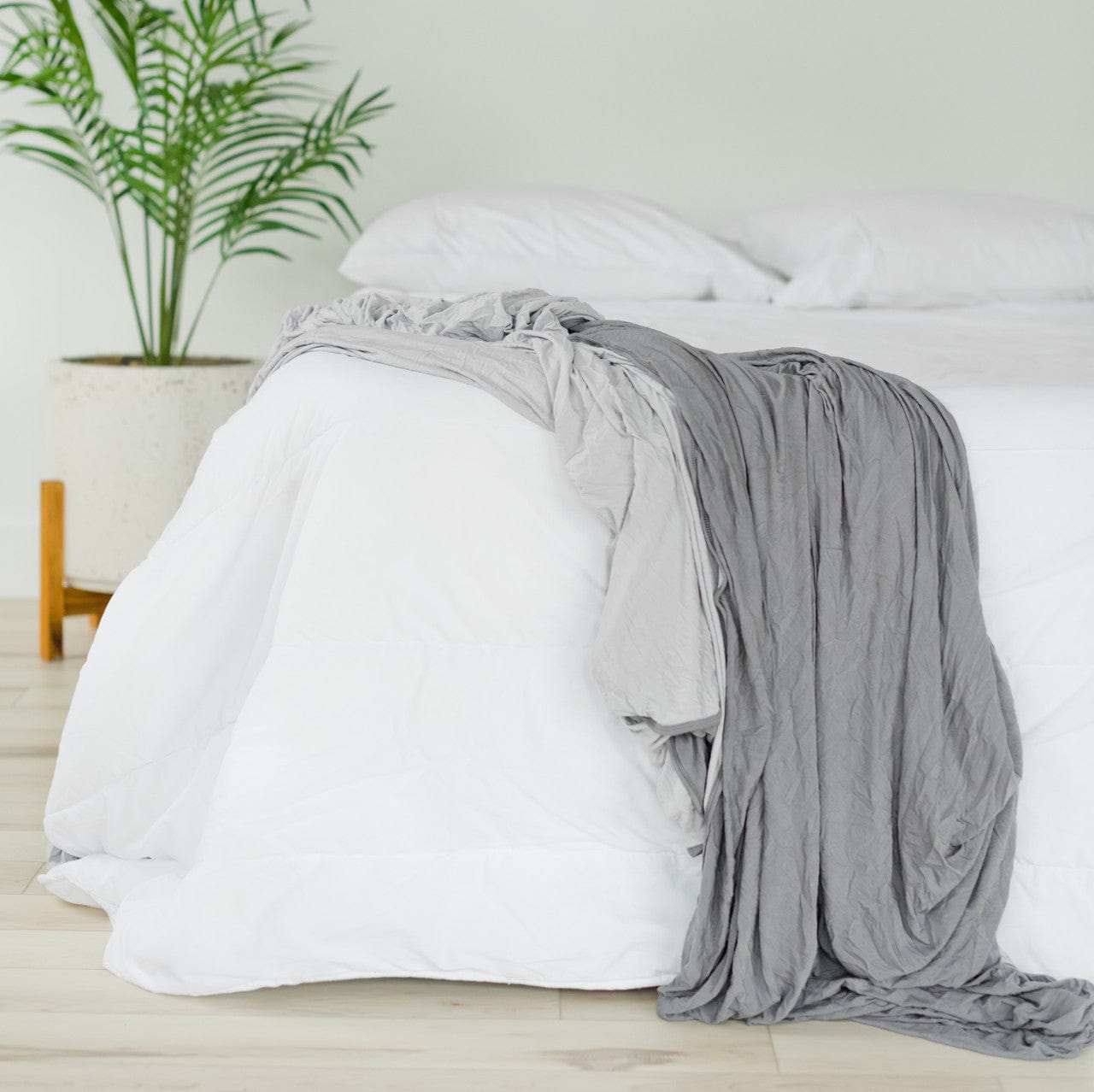 Light and dark grey bed luxurious blanket.